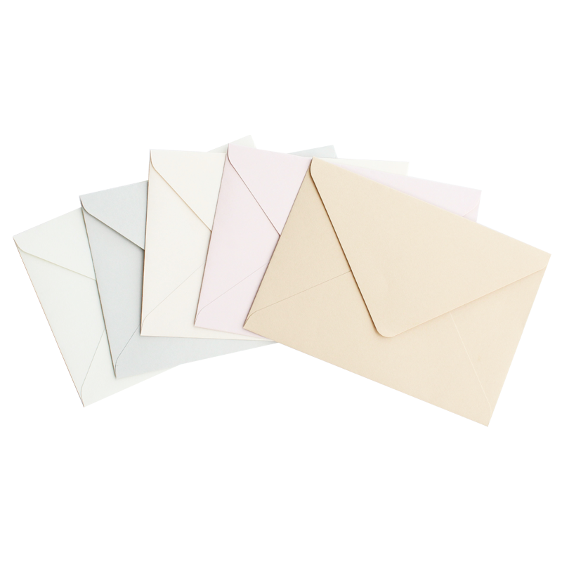 Envelope with triangular flap